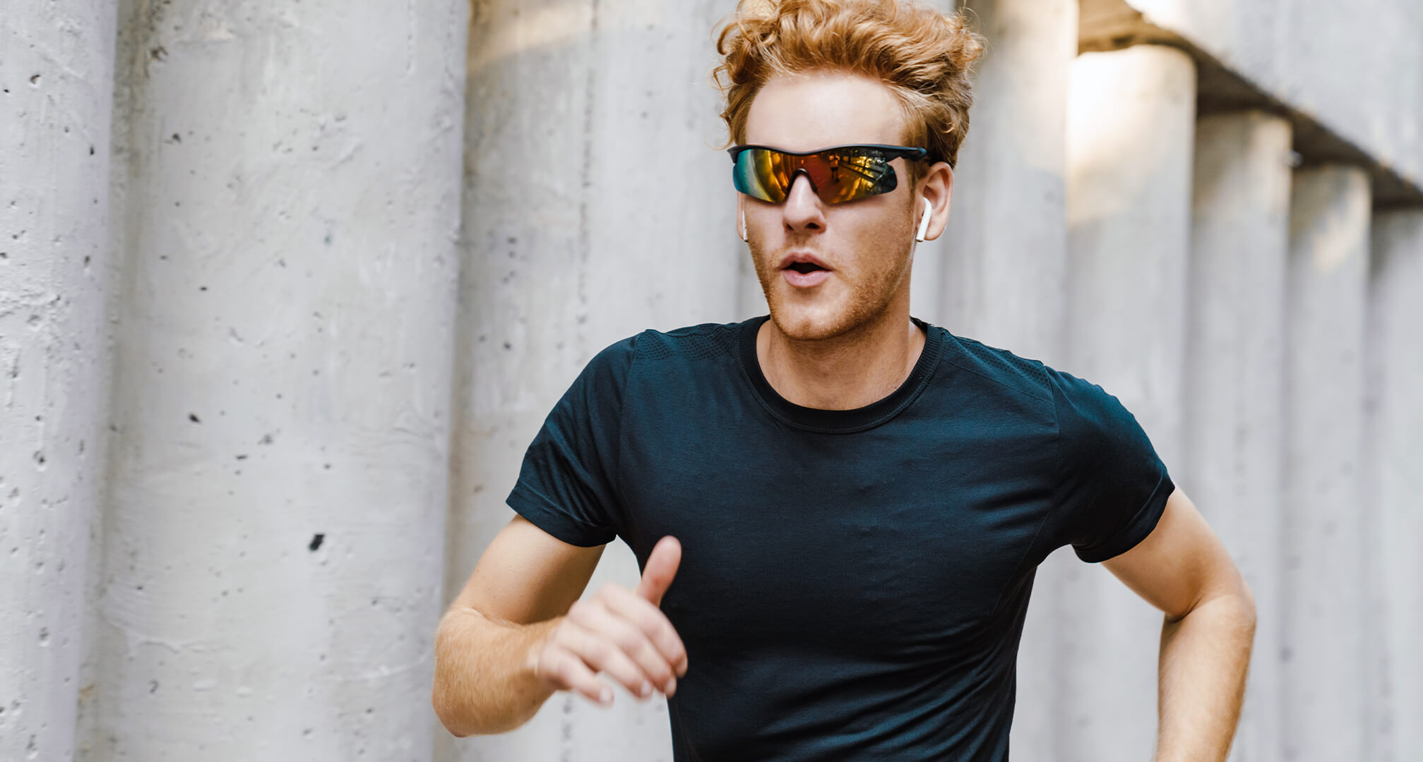 person running in mirrored sunglasses